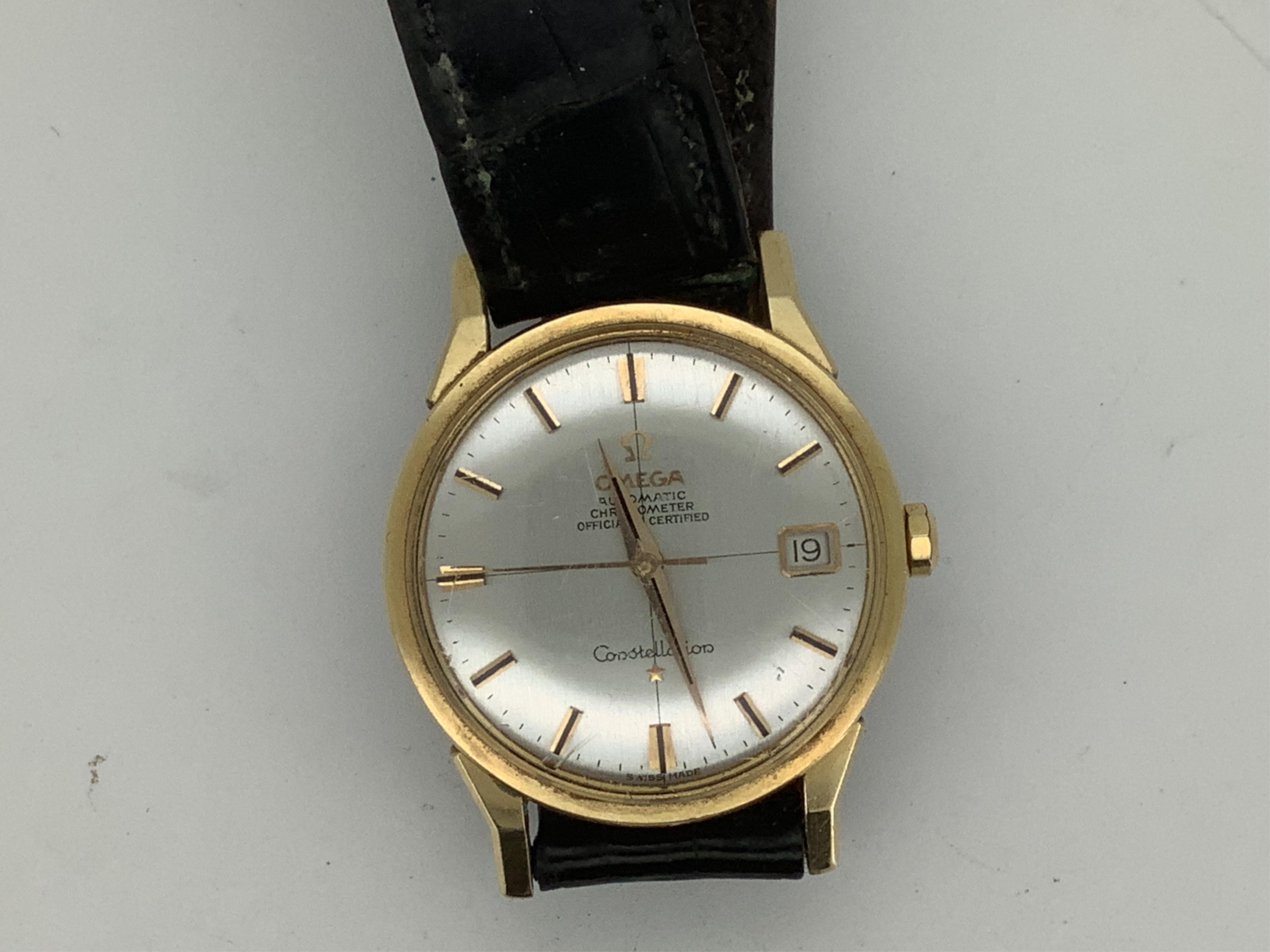 A gentleman's 1960's? steel and gold plated Omega Constellation Automatic Chronometer wrist watch, with baton numerals and date aperture, case diameter 35mm, on a leather strap with Omega gold plated buckle, no box or pa